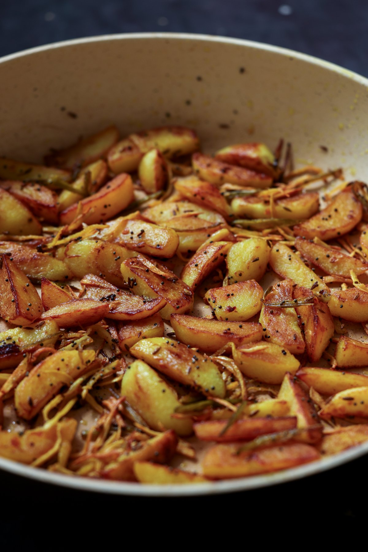 side view of Nepali aloo in the pan after cooking