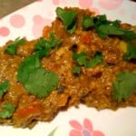 Baingan Barta served on a white and pink patterned plate