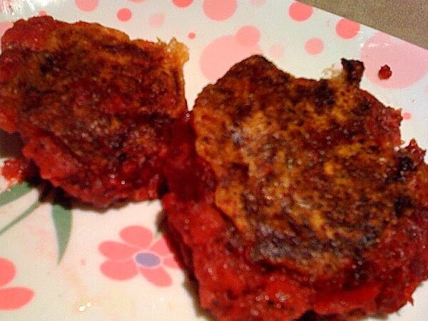 Two beet and potato cutlets on a pink and white patterned plate