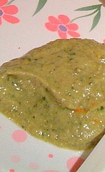 Cilantro garlic hummus on a white and pink patterned plate