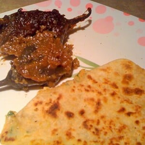 Aloo Paratha on a white and pink patterned plate