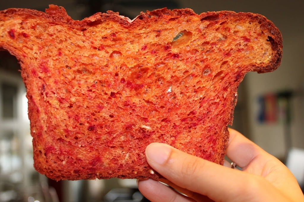 A delicious and colorful beetroot bread with orange zest. This recipe is simple, delicious and makes great sandwiches or a healthy snack any time of the day. Vegan Recipe. #vegan #veganricha
