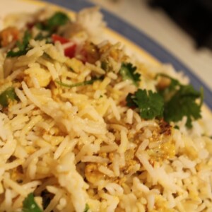 A close up of a plate of mughlai veggie biryani