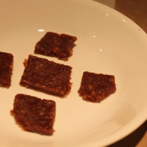 Squares of date fig burfi on a white plate