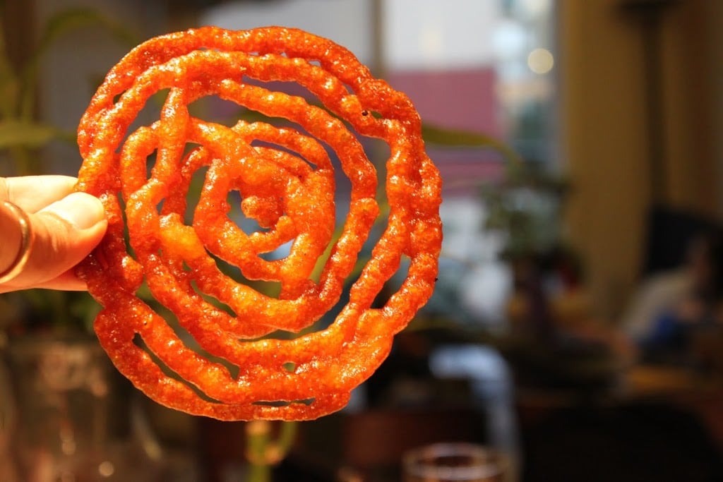 Vegan jalebi Recipe - Indian Sweet shaped like pretzels, deep fried and dipped in sugar syrup. Like a funnel cake.