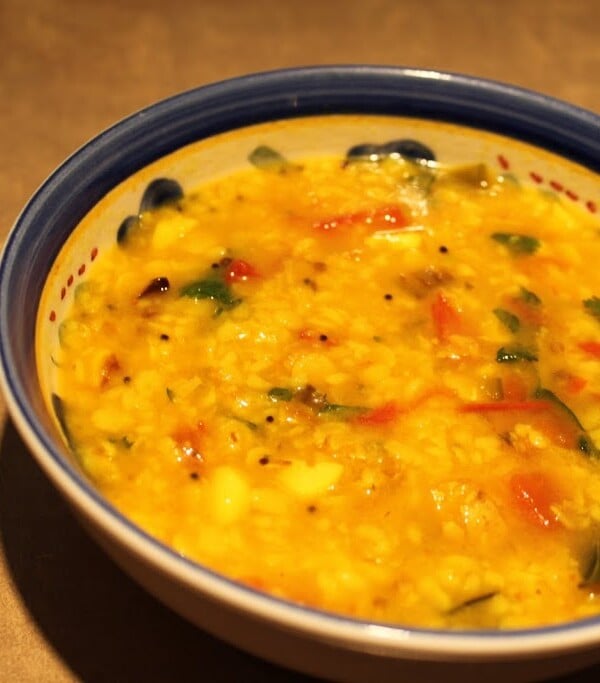 Yellow mung and toor in a bowl with a blue rim