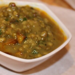 Green mung dall served in a white bowl