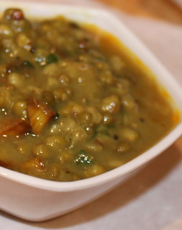 Green mung dall served in a white bowl