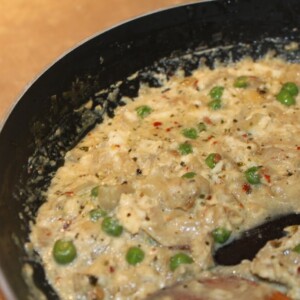 Paneer being cooked in a pan