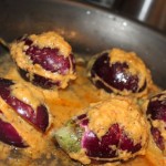 Anchari Baingan being cooked in a black pan