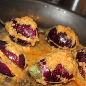 Anchari Baingan being cooked in a black pan