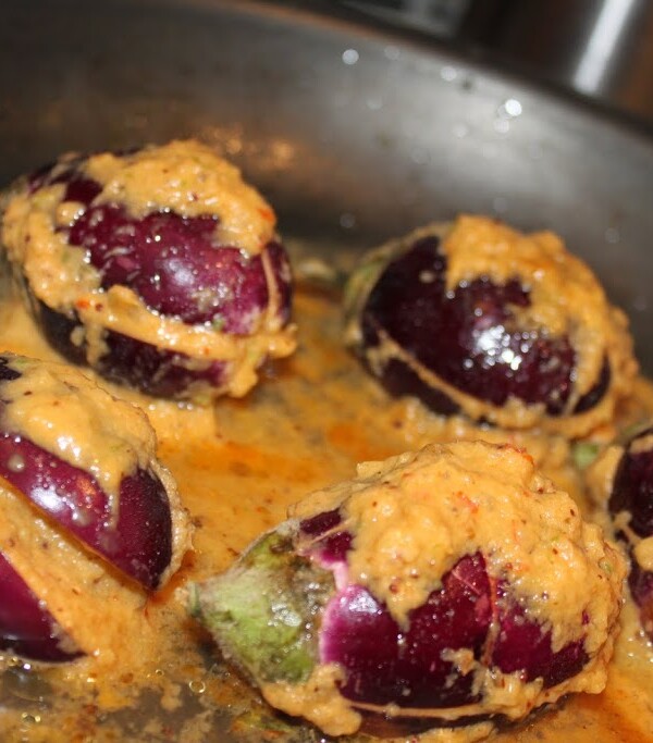 Anchari Baingan being cooked in a black pan