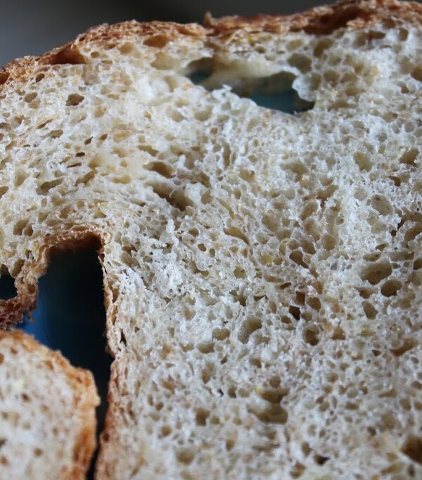 slices of lemony multigrain loaf on a blue plate