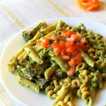 Basil cashew pesto with penne served on a white plate
