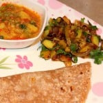 Aloo Pyaaz and Bhaji with Roti/Chapat served on a white and pink plate