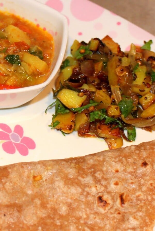 Aloo Pyaaz and Bhaji with Roti/Chapat served on a white and pink plate