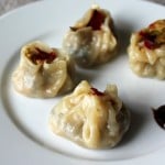 Shu Mai dumplings served on a white plate