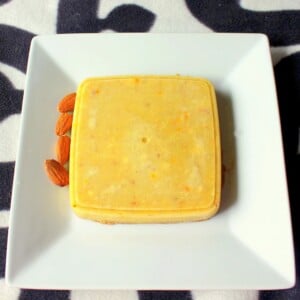 Kulfi served on a white plate on a black and white background