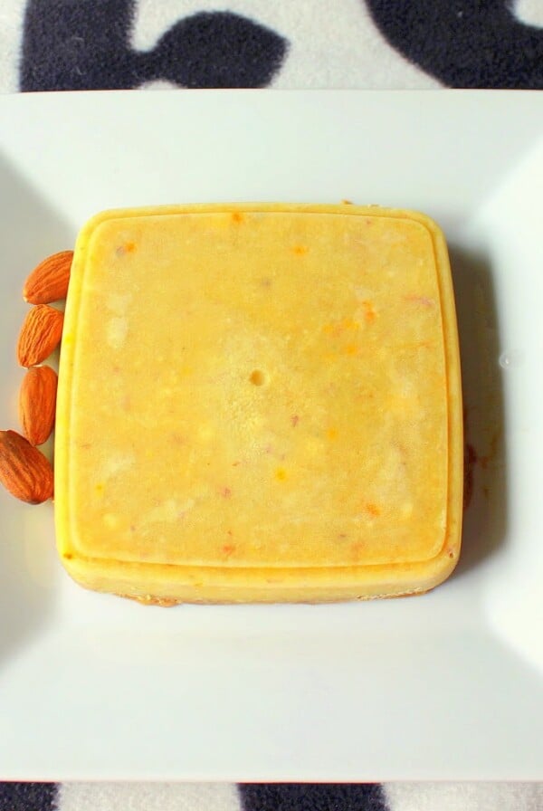 Kulfi served on a white plate on a black and white background