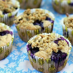 Lemon Blueberry Multigrain Muffins on a blue and white tablecloth