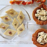 Vegan kaju katli served on a glass plate