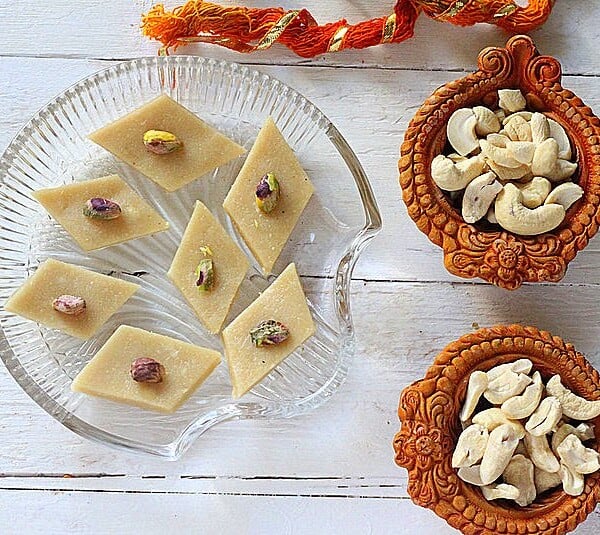 Vegan kaju katli served on a glass plate