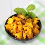Potatoes with whole indian spices served in a bowl with cilantro garnish