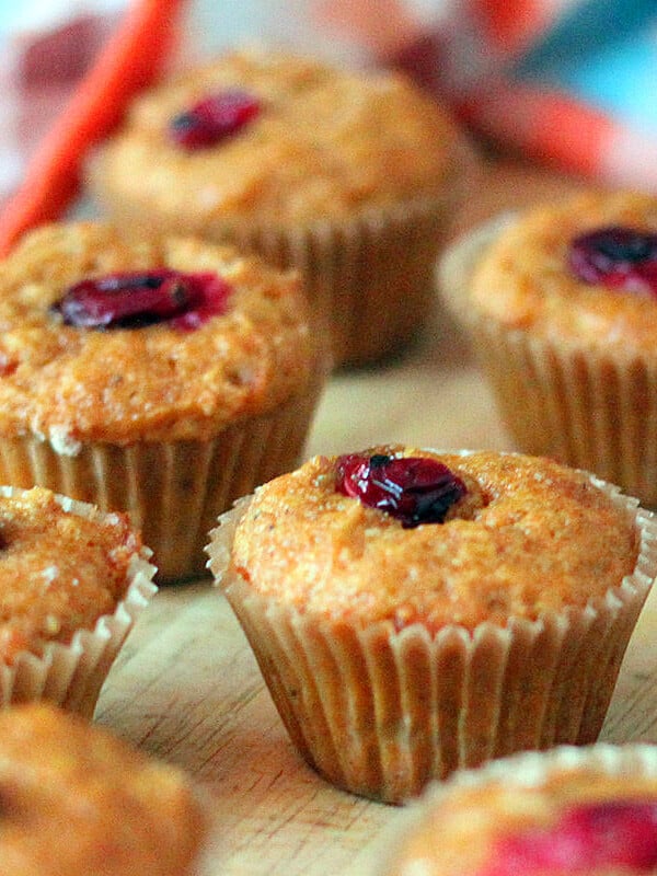 Carrot almond cakes laid out on a wooden work surface