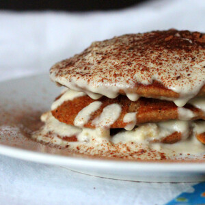 Vegan tiramisu pancakes stacked on a white plate