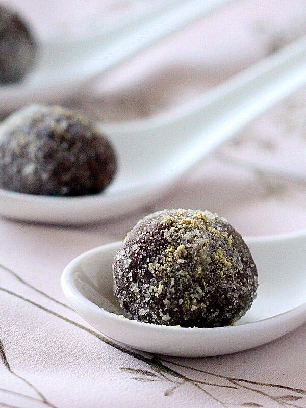 Gingerbread spiced Chocolate Nut butter truffles on white serving spoons