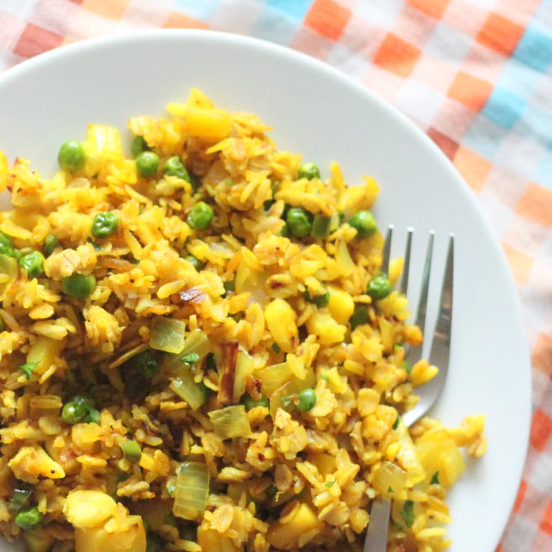 Oats Poha, a delicious and nutritious savory breakfast recipe made with rice flakes, veggies and spices. Full of flavor and easy to make. Vegan and Gluten Free Recipe. #glutenfree #veganricha #vegan