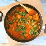 Kadai Gobi in a pan with a wooden spoon in it.