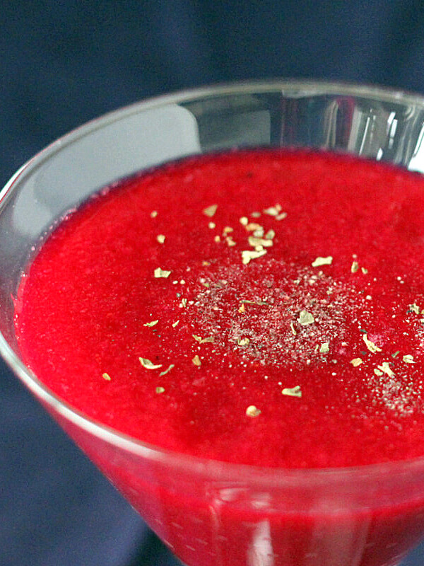 Red Beet, Pear, Minneola orange and Apple Smoothie served in a martini glass