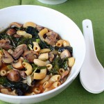 mushroom rainbow chard shallot soup served in a white bowl