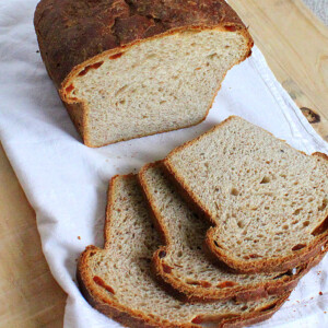 Grape multigrain bread on a white cloth cut into slices