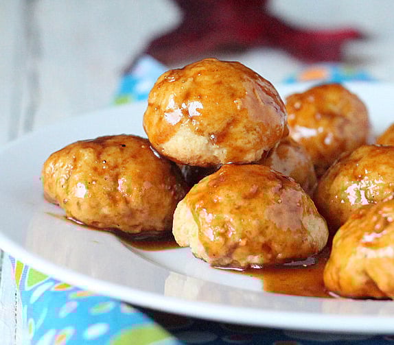 Sweet potato donut bites served high on a white plate
