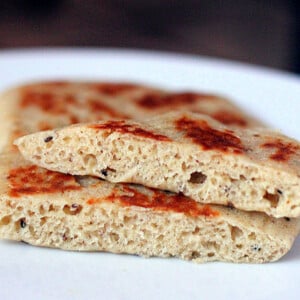 A close up of vegan gluten free naan cut in half