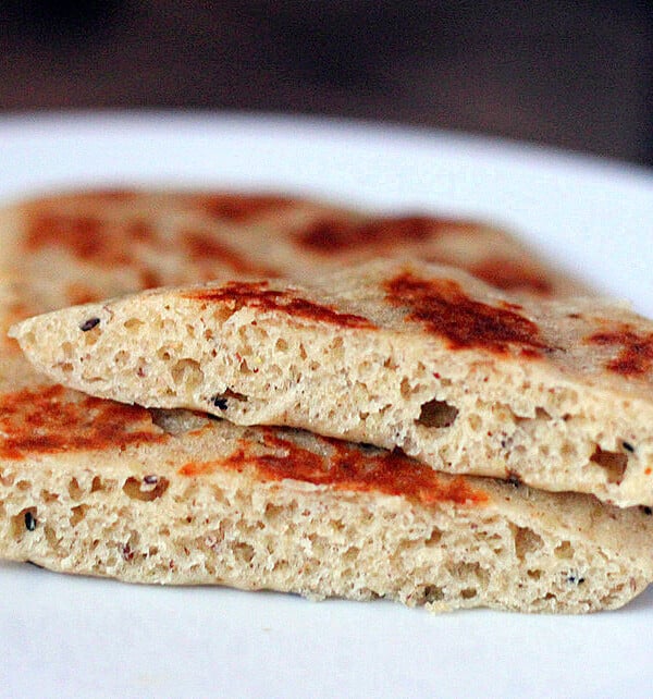A close up of vegan gluten free naan cut in half