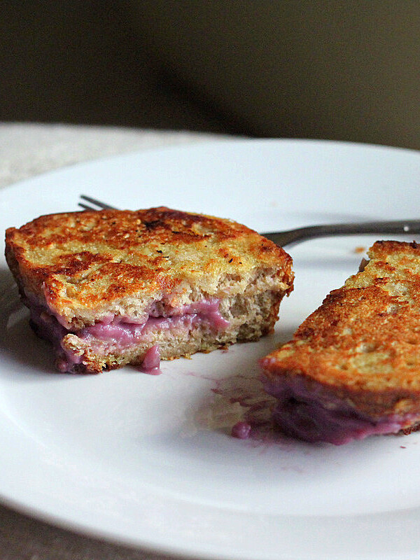 Stuffed French Toast cut in half on a white plate