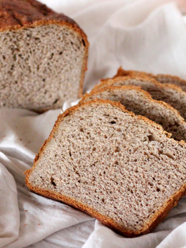 Slices of No Knead Strawberry Wheat Bread Loaf on white fabric