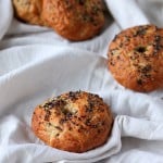 Wheat bagels placed on white fabric