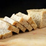 Slices of gluten free sourdough bread on a wooden chopping board