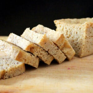 Slices of gluten free sourdough bread on a wooden chopping board