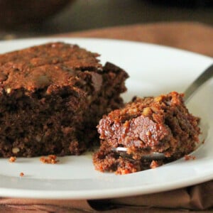 Vegan mocha chocolate cake served on a white plate