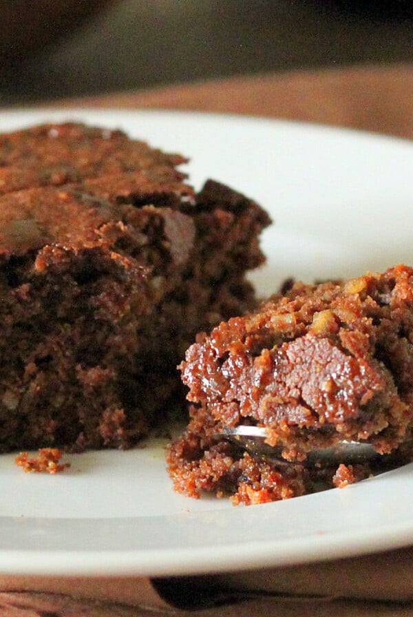 Vegan mocha chocolate cake served on a white plate