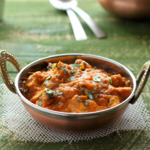 Tempeh tikka masala served in a metal dish