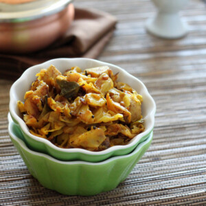 Spiced cabbage and potato in a small green bowl