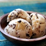 Three scoops of ice cream in a wooden bowl