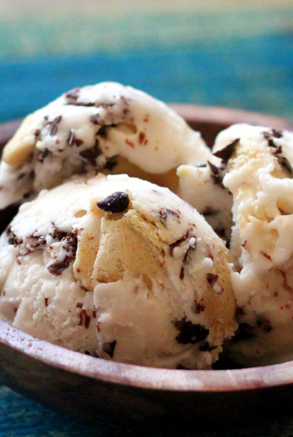 Three scoops of ice cream in a wooden bowl