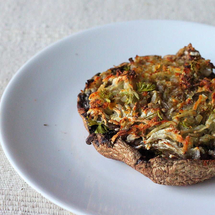 Portabella stuffed with Hash browns. Cheesy russet potato shreds stuffed in mushrooms and baked. | VeganRicha.com #vegan #glutenfree #breakfast